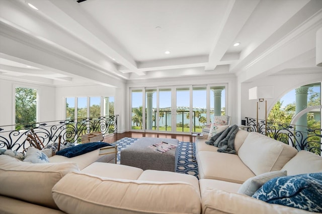 living room featuring recessed lighting, plenty of natural light, beamed ceiling, and wood finished floors