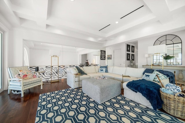 living room featuring a tray ceiling, wood finished floors, and recessed lighting