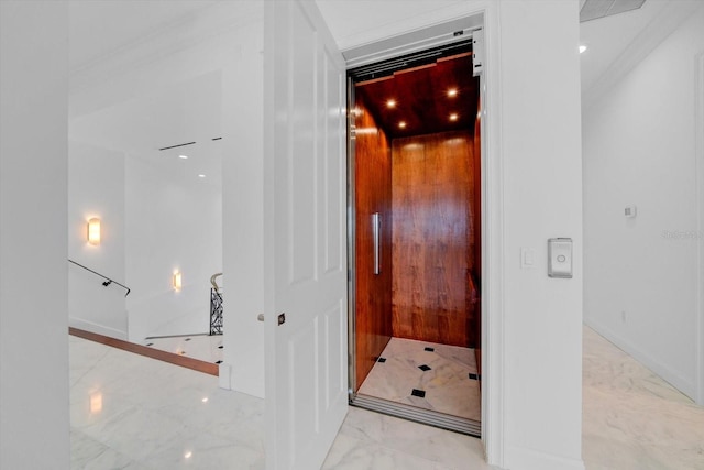 bathroom featuring marble finish floor, elevator, and baseboards