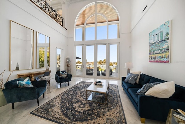 living room with a towering ceiling