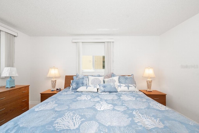 bedroom featuring a textured ceiling