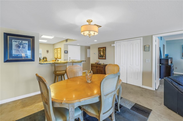 dining area featuring baseboards