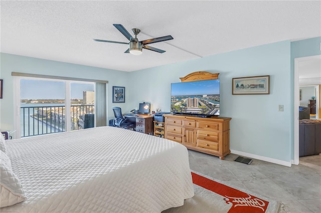 bedroom featuring a ceiling fan, access to outside, a textured ceiling, and baseboards