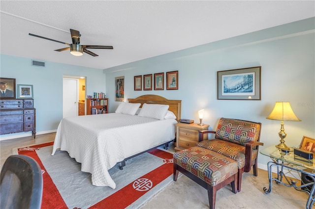 bedroom with visible vents, ceiling fan, and baseboards