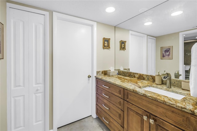 bathroom with recessed lighting, visible vents, a closet, and vanity