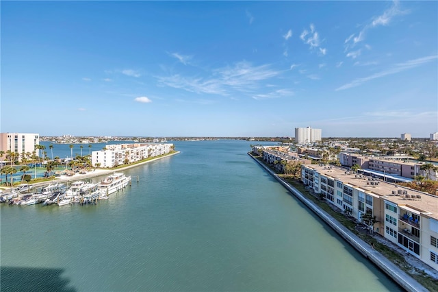 birds eye view of property with a water view and a view of city