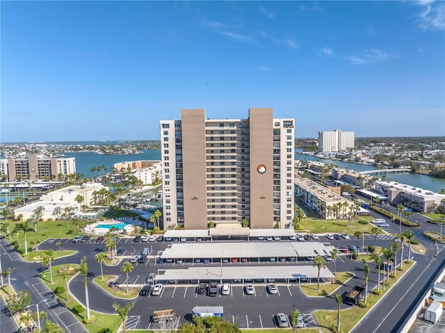 birds eye view of property featuring a water view and a city view