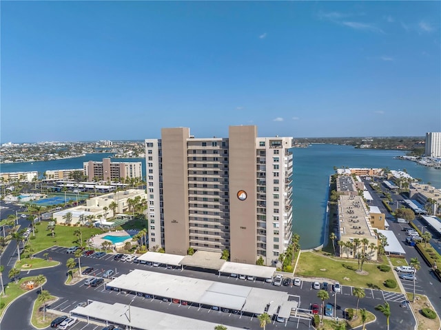 birds eye view of property with a view of city and a water view