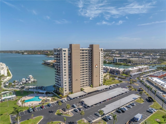 drone / aerial view featuring a water view and a view of city