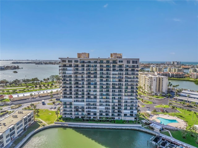 birds eye view of property featuring a view of city and a water view