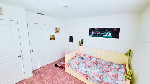 bedroom with carpet floors and visible vents