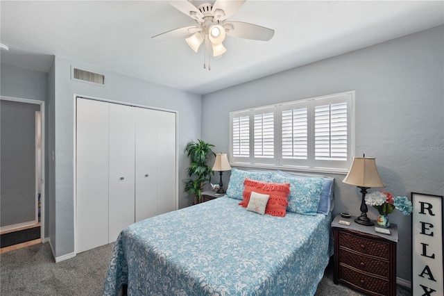 carpeted bedroom with ceiling fan, visible vents, and a closet