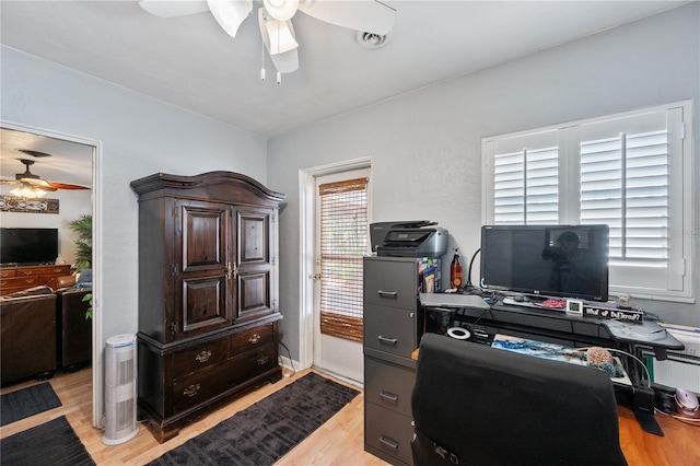 office space with ceiling fan and light wood-type flooring