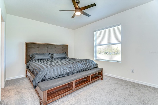 bedroom with carpet flooring, a ceiling fan, and baseboards