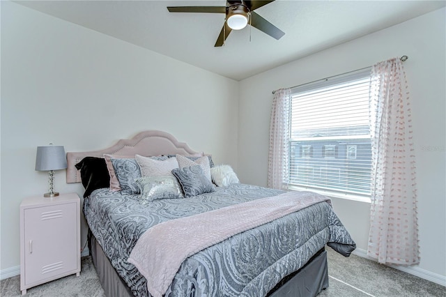 bedroom with baseboards, light carpet, and ceiling fan