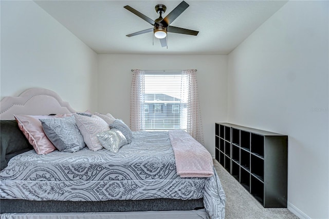 bedroom with baseboards, carpet, and ceiling fan