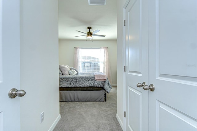 bedroom with a ceiling fan, baseboards, visible vents, and carpet floors