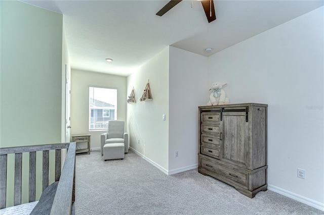 bedroom with carpet flooring, a ceiling fan, and baseboards