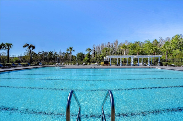 community pool featuring a pergola