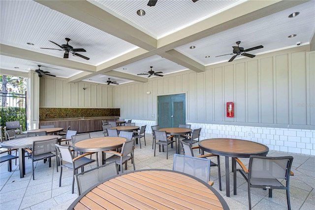 view of patio / terrace with outdoor dining area, ceiling fan, and fence