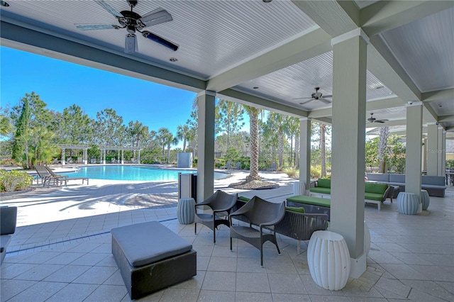 view of patio / terrace with an outdoor hangout area, a pergola, and a community pool