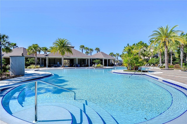 community pool featuring a patio area