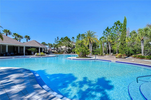 community pool featuring a patio area