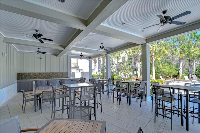 view of patio / terrace featuring outdoor dining space and a ceiling fan