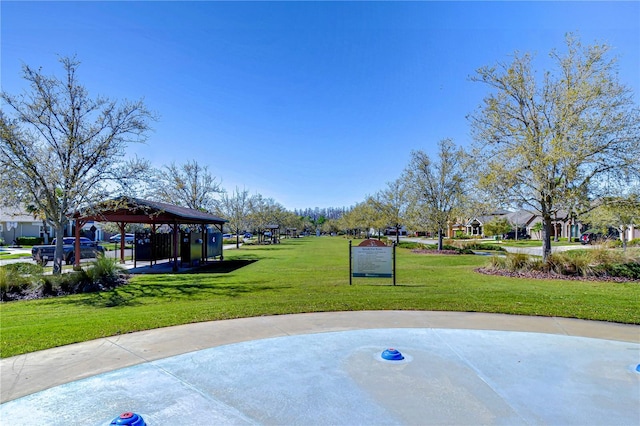 surrounding community featuring a gazebo and a lawn