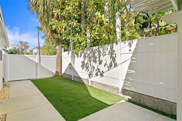 view of yard with a fenced backyard