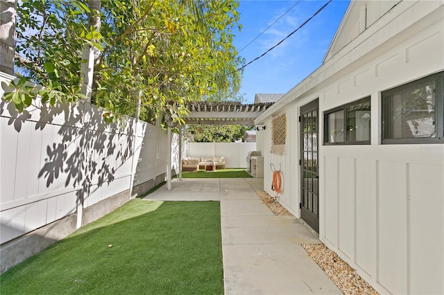 view of yard with a patio, a fenced backyard, and a pergola