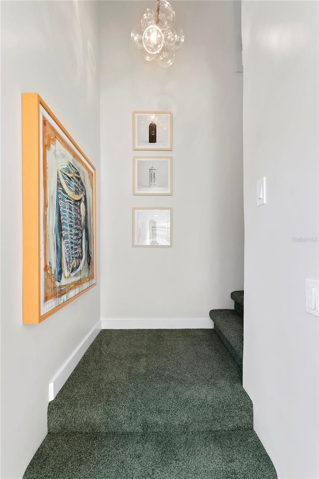 stairway with carpet flooring and baseboards