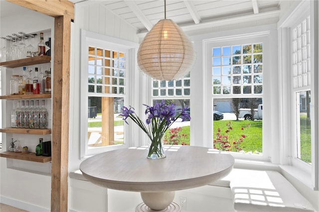 sunroom with beam ceiling