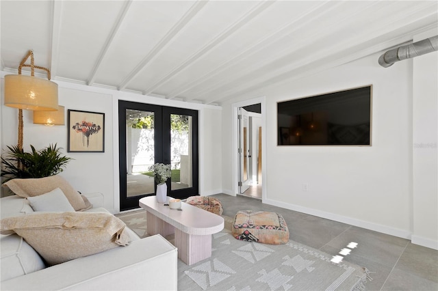 living room featuring vaulted ceiling with beams, french doors, and baseboards