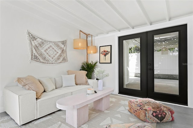 interior space featuring french doors and beam ceiling