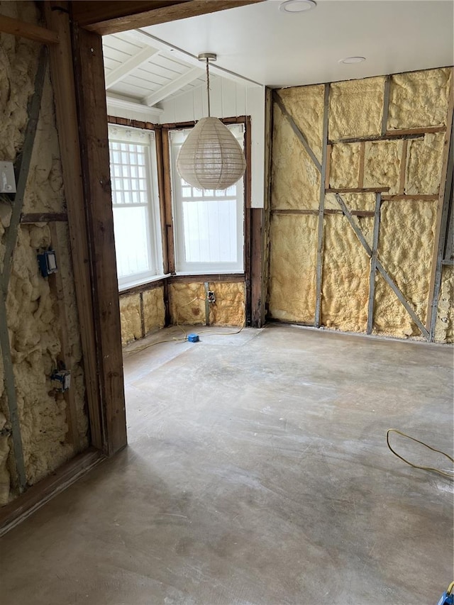 unfurnished room featuring concrete flooring