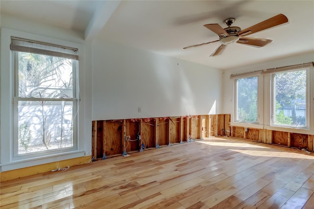 unfurnished room with a ceiling fan and wood finished floors