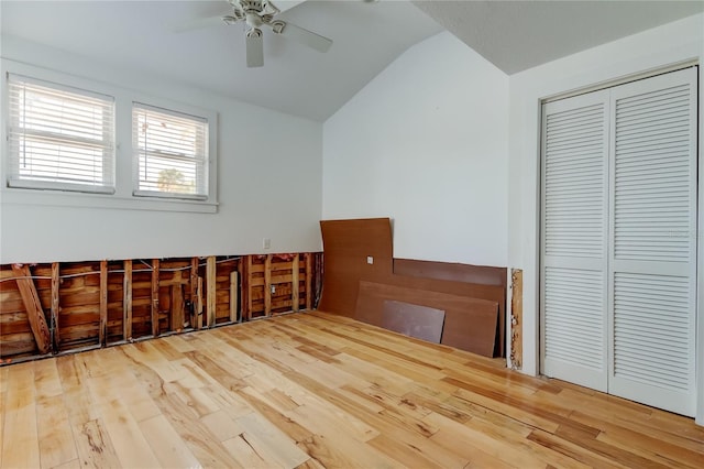 interior space featuring ceiling fan, lofted ceiling, and wood finished floors