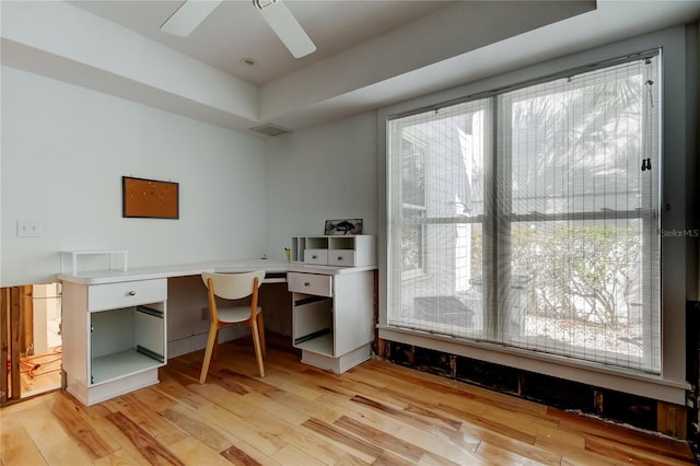 office with ceiling fan, visible vents, and wood finished floors