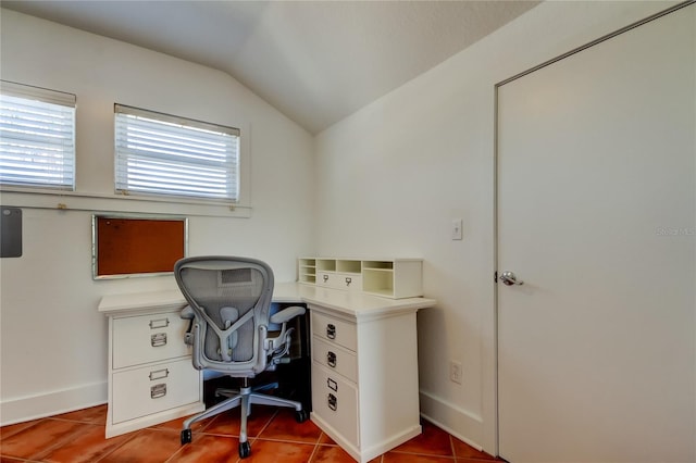 tiled home office featuring lofted ceiling and baseboards