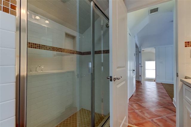 bathroom featuring vanity, a shower stall, visible vents, and tile patterned floors