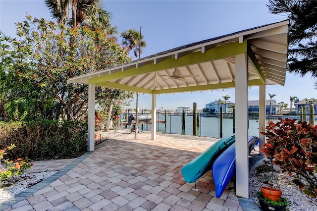 view of patio with a gazebo and a water view