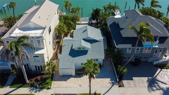 birds eye view of property featuring a water view and a residential view