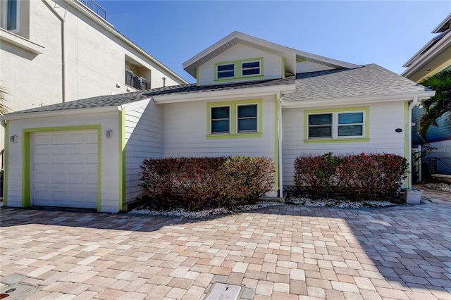 view of home's exterior featuring roof with shingles
