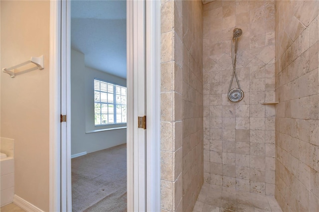 full bath with tiled shower