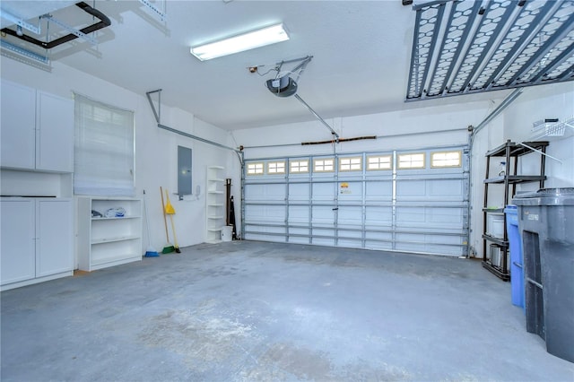 garage with electric panel and a garage door opener