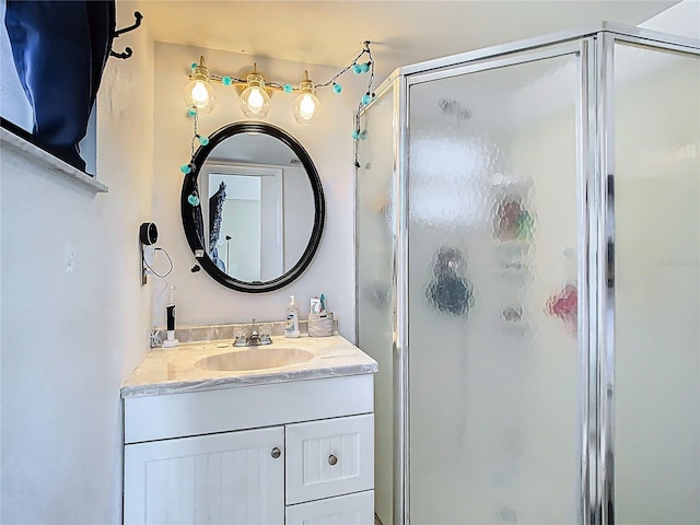 full bath with vanity and a stall shower