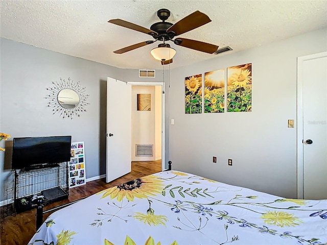 bedroom featuring visible vents and a textured ceiling