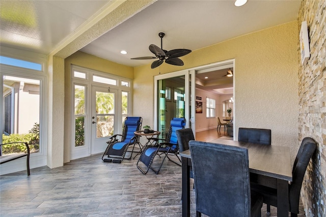 sunroom with a ceiling fan