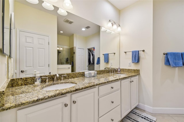 full bathroom featuring a sink, visible vents, and a stall shower